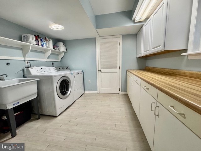 1282 Masters Dr Unit 190, Arnold, MD 21012 - laundry room with washing machine and dryer, cabinet space, light wood-type flooring, and baseboards