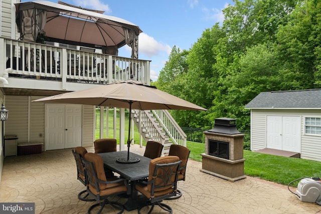1 Pinkerton Ct, Stafford, VA 22554 - view of patio featuring a fireplace, stairs, outdoor dining space, and a gazebo
