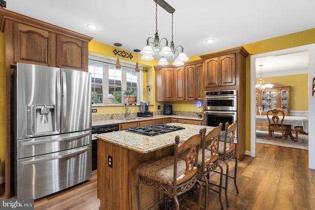 1 Pinkerton Ct, Stafford, VA 22554 - kitchen with stainless steel appliances, a chandelier, light stone countertops, crown molding, and decorative light fixtures