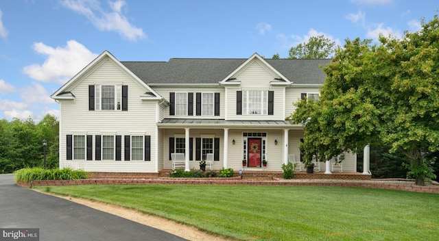 1 Pinkerton Ct, Stafford, VA 22554 - view of front of property featuring a standing seam roof, covered porch, a front yard, metal roof, and a shingled roof