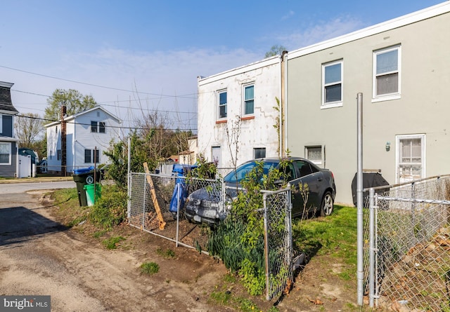 502 Page St, Woodbury, NJ 08096 - exterior space featuring fence, a gate, and stucco siding