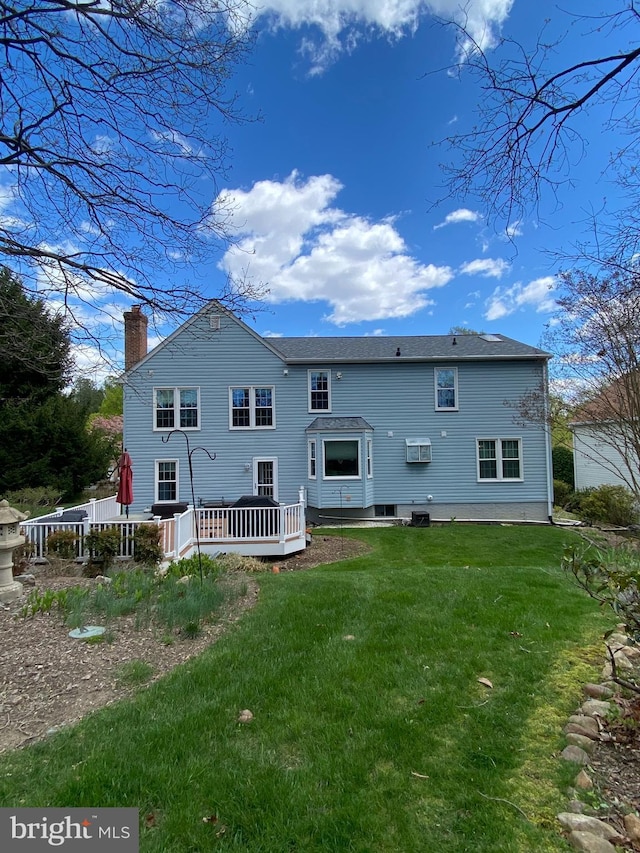 8806 Cardinal Ct, Laurel, MD 20723 - back of property featuring a chimney, a lawn, and a deck