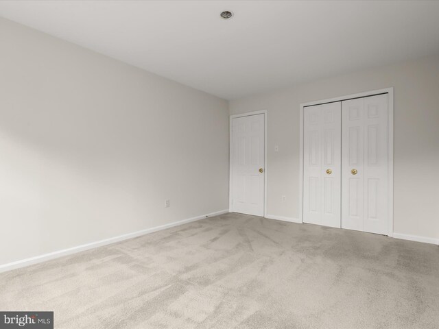 8806 Cardinal Ct, Laurel, MD 20723 - unfurnished bedroom with carpet, baseboards, and a closet