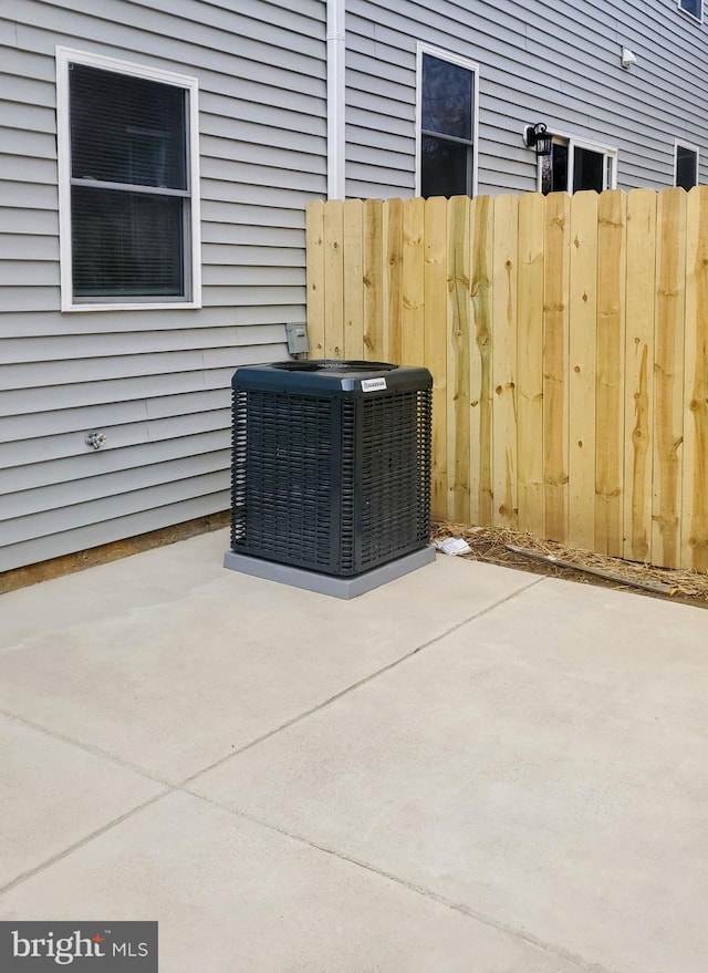 exterior details with cooling unit and fence