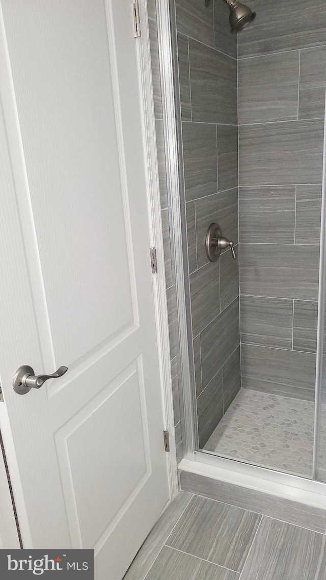 bathroom with a shower stall