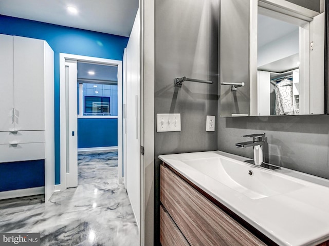 3411 Woodberry Ave, Baltimore, MD 21211 - bathroom featuring recessed lighting, vanity, marble finish floor, and baseboards