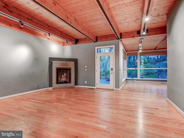3411 Woodberry Ave, Baltimore, MD 21211 - unfurnished living room featuring rail lighting, wood finished floors, and wood ceiling