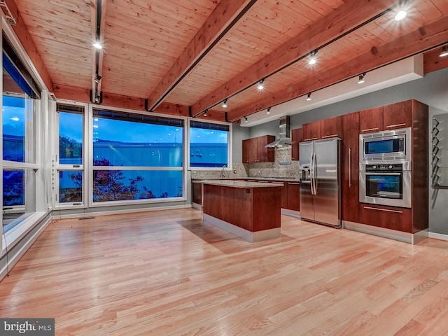 3411 Woodberry Ave, Baltimore, MD 21211 - kitchen with track lighting, wall chimney exhaust hood, stainless steel appliances, light wood finished floors, and wooden ceiling