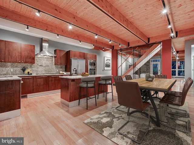 3411 Woodberry Ave, Baltimore, MD 21211 - dining room with rail lighting, light wood-type flooring, wood ceiling, and beam ceiling