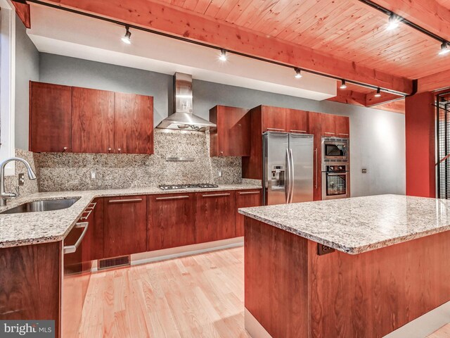 3411 Woodberry Ave, Baltimore, MD 21211 - kitchen with track lighting, visible vents, a sink, wall chimney range hood, and stainless steel appliances