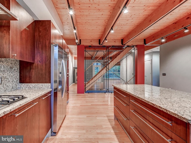 3411 Woodberry Ave, Baltimore, MD 21211 - kitchen featuring track lighting, light wood-type flooring, wood ceiling, stainless steel appliances, and decorative backsplash