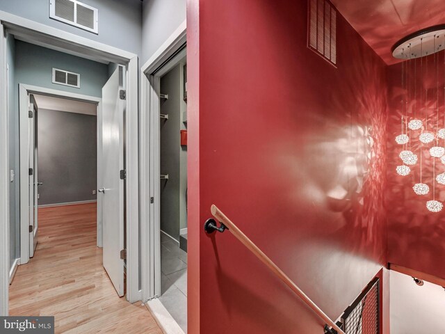 3411 Woodberry Ave, Baltimore, MD 21211 - hallway with wood finished floors and visible vents
