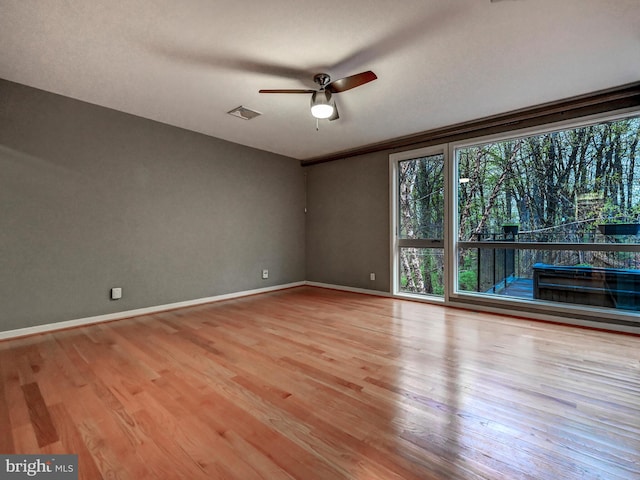 3411 Woodberry Ave, Baltimore, MD 21211 - unfurnished room featuring visible vents, ceiling fan, wood finished floors, and baseboards