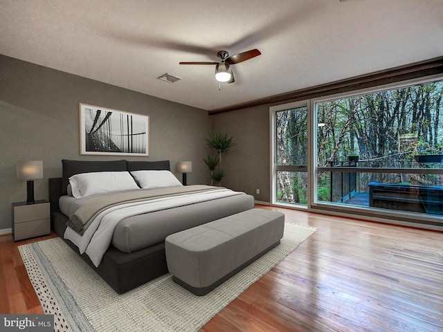 3411 Woodberry Ave, Baltimore, MD 21211 - bedroom featuring wood finished floors, ceiling fan, baseboards, and visible vents