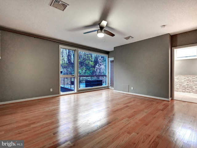 3411 Woodberry Ave, Baltimore, MD 21211 - unfurnished room featuring light wood-style floors, visible vents, baseboards, and a ceiling fan