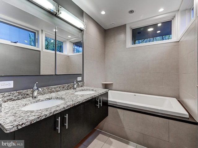 3411 Woodberry Ave, Baltimore, MD 21211 - bathroom with a sink, tile patterned floors, double vanity, and a garden tub