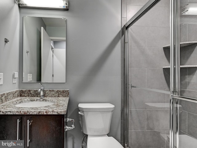 3411 Woodberry Ave, Baltimore, MD 21211 - bathroom with toilet, a shower stall, and vanity