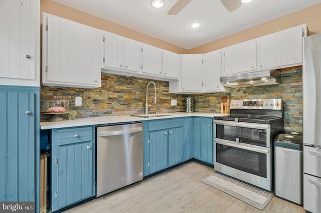305 W Poplar Rd, Sterling, VA 20164 - kitchen featuring under cabinet range hood, blue cabinetry, stainless steel appliances, and a sink