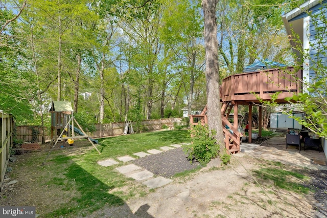 305 W Poplar Rd, Sterling, VA 20164 - view of yard with a fenced backyard, a deck, a patio area, and a playground