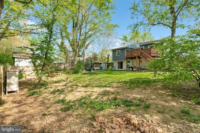 305 W Poplar Rd, Sterling, VA 20164 - view of yard featuring stairway, fence, and a deck