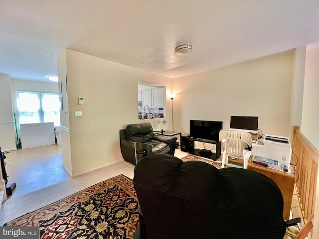 living area with light carpet