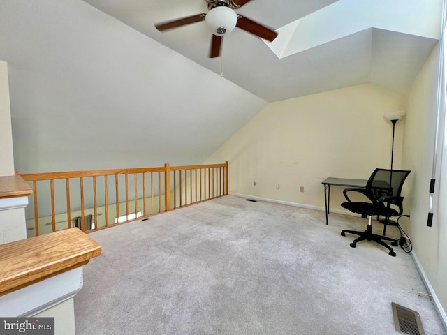 bonus room with a ceiling fan, carpet flooring, visible vents, and vaulted ceiling with skylight