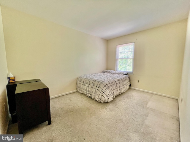 carpeted bedroom with baseboards