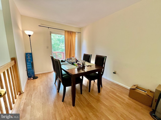 dining room featuring light wood-style floors and baseboards