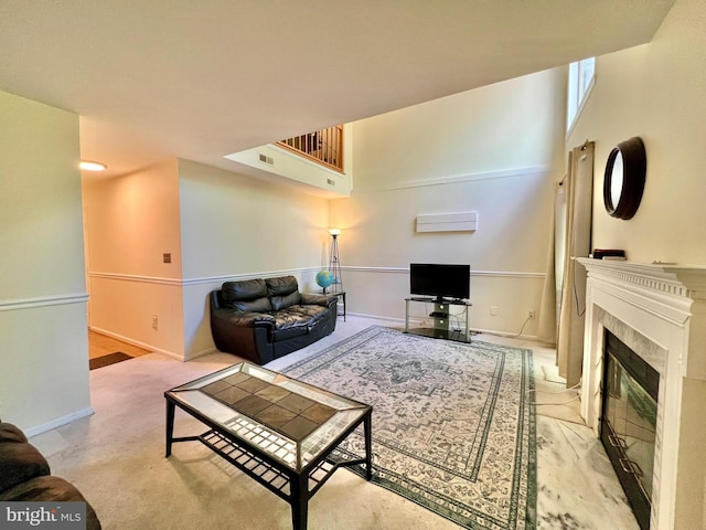 carpeted living area with baseboards, a tile fireplace, and visible vents