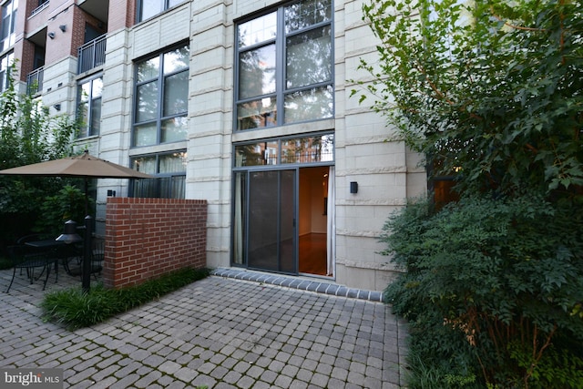 entrance to property featuring a patio