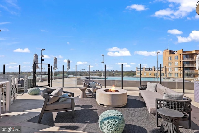 view of patio featuring an outdoor fire pit