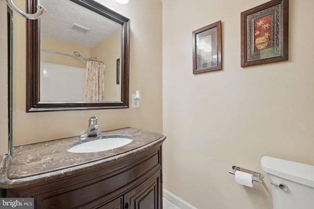 full bathroom with vanity and toilet