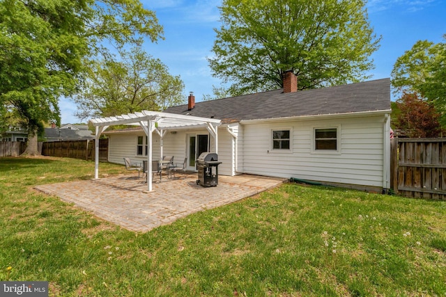 back of property featuring a chimney, a patio area, a pergola, a yard, and a fenced backyard
