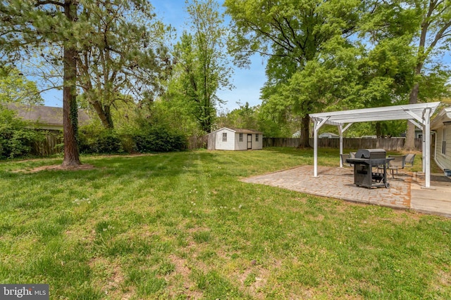 view of yard featuring an outdoor structure, a fenced backyard, a storage unit, a patio, and a pergola