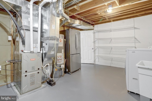 unfinished below grade area with water heater and freestanding refrigerator