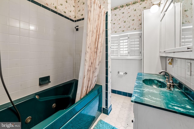 bathroom featuring vanity, tile patterned flooring, wainscoting, a combined bath / shower with jetted tub, and wallpapered walls
