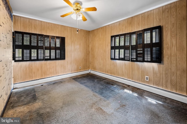 carpeted empty room with a ceiling fan