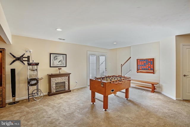 rec room with baseboards, visible vents, and carpet floors