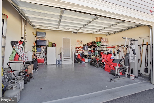 garage with freestanding refrigerator