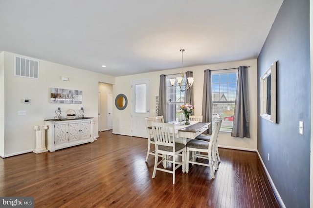dining space featuring baseboards, a notable chandelier, dark wood-type flooring, visible vents, and recessed lighting