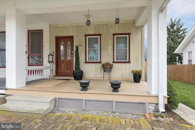doorway to property featuring a porch