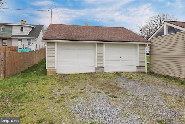 detached garage with fence