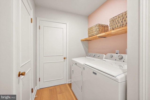210 N Main St, Berlin, MD 21811 - washroom with separate washer and dryer, laundry area, and light wood-style flooring