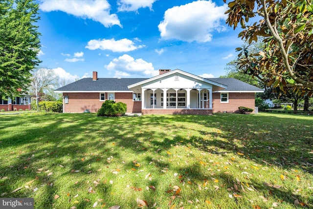 210 N Main St, Berlin, MD 21811 - rear view of house with brick siding, a lawn, and covered porch
