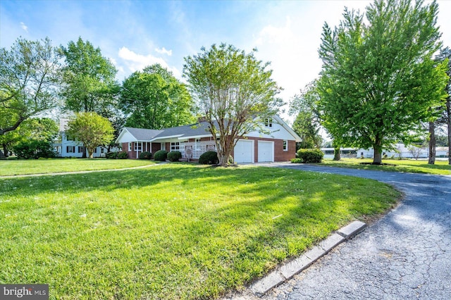 210 N Main St, Berlin, MD 21811 - single story home featuring an attached garage, a front lawn, and driveway