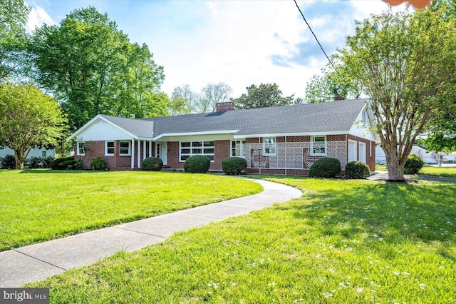 210 N Main St, Berlin, MD 21811 - ranch-style home with brick siding, a garage, a front lawn, and a chimney
