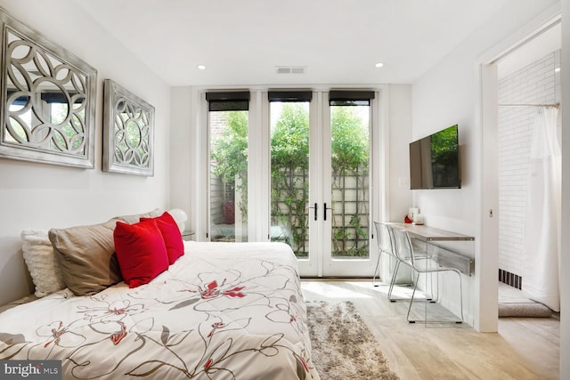 bedroom with visible vents, access to exterior, recessed lighting, french doors, and light wood finished floors