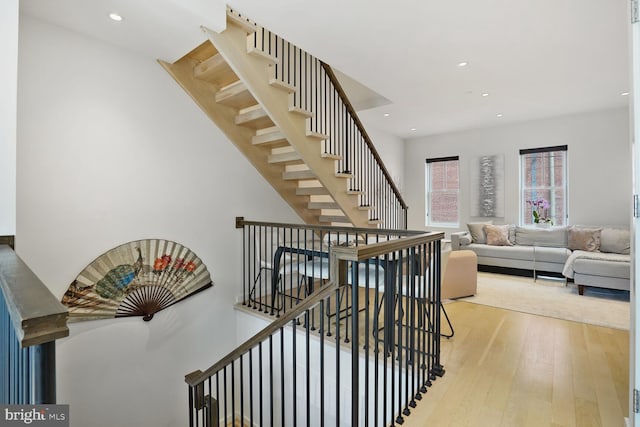 staircase featuring recessed lighting and hardwood / wood-style flooring