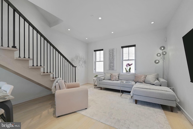 living room with stairway, baseboards, recessed lighting, and wood finished floors