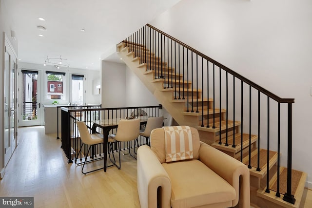 staircase featuring recessed lighting and wood finished floors